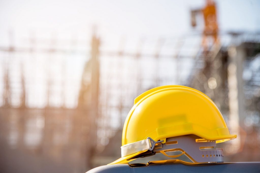Helmet,In,Construction,Site,And,Construction,Site,Worker,Background,Safety